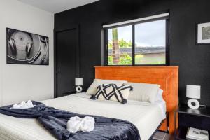 a bedroom with a large bed and a window at Unit 1 Cozy 1BR Apt with Parking in Miami