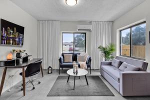 a living room with a couch and a table at Unit 1 Cozy 1BR Apt with Parking in Miami