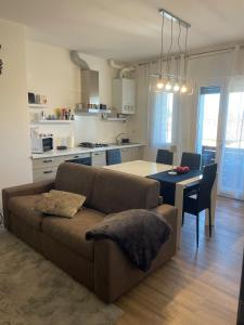 a living room with a couch and a table at Treviso Home Chic in Treviso +22 photos