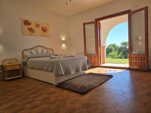 a bedroom with a bed and an open door at Cortijo de la luna la casita in Taramay +68 photos