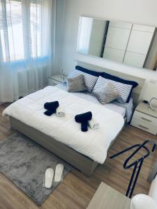 a bedroom with a bed with two pillows on it at Treviso Home Chic in Treviso