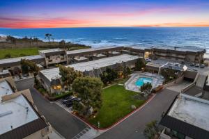an aerial view of a resort with the ocean at Ocean Breeze Getaway - Solana Beach Condo in Solana Beach