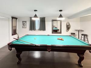a pool table in the middle of a room at Walker Ridge in Montrose