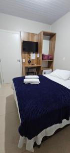 Ένα ή περισσότερα κρεβάτια σε δωμάτιο στο Hotel Querência