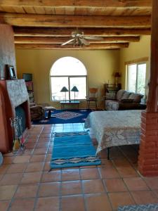 a living room with a couch and a fireplace at Indian Ridge Casita in Willcox