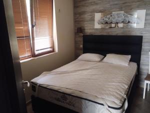 En eller flere senge i et værelse på Рай