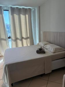 En eller flere senge i et værelse på Loft Prainha 421