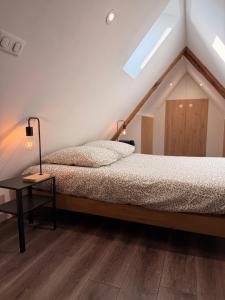 En eller flere senge i et værelse på La cotonnade - Entre vignes et ville