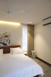 Ένα ή περισσότερα κρεβάτια σε δωμάτιο στο Reflections by SOL Escapes