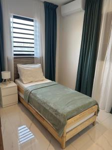 Ένα ή περισσότερα κρεβάτια σε δωμάτιο στο Appartement Amor