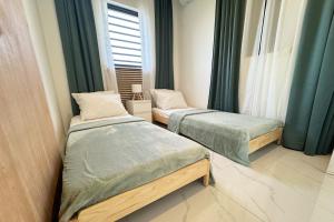 Ένα ή περισσότερα κρεβάτια σε δωμάτιο στο Appartement Amor