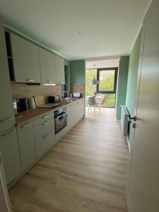 Kuchyň nebo kuchyňský kout v ubytování Gemütliche Heidschnucke + 15 fotografií