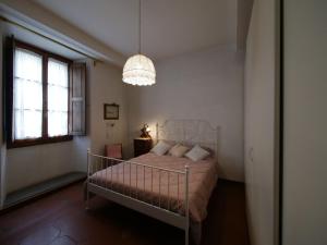 Una cama o camas en una habitación de Alloggiare nei luoghi dove é vissuto Dante