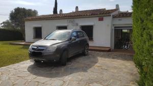 a silver car parked in front of a house at Acacies 25 in Torroella de Montgrí