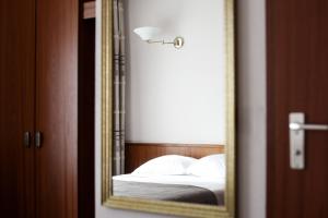 Ένα ή περισσότερα κρεβάτια σε δωμάτιο στο Hotel de l' Esplanade