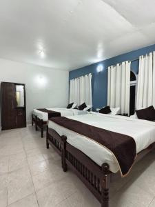 Postel nebo postele na pokoji v ubytování Kalanja Greens Nilagiri Villa