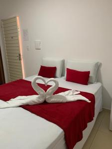 Ένα ή περισσότερα κρεβάτια σε δωμάτιο στο Pousada Girassol