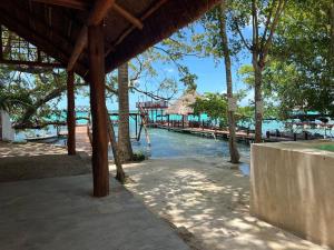 a view of a pier with a resort in the water at Hotel Casa Del Angel in Chetumal