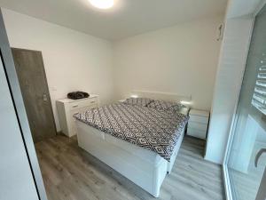Postel nebo postele na pokoji v ubytování Apartmán Raj