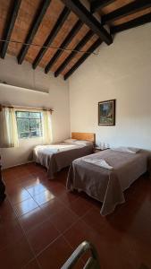 a bedroom with two beds in a room at Calli Yoloiztac in Cedro +58 photos