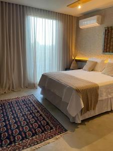 Ένα ή περισσότερα κρεβάτια σε δωμάτιο στο Casa de Luxo na praia - São Miguel dos Milagres