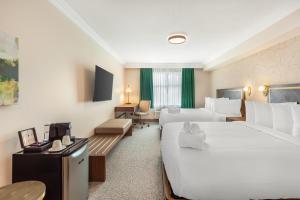 Postel nebo postele na pokoji v ubytování Velora Hinton, an Ascend Collection Hotel + 65 fotografií