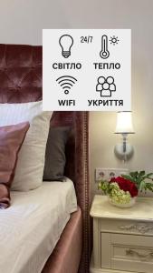 Postel nebo postele na pokoji v ubytování LvApart вул Ковжуна 2 кім ізол кухня студія звітні документи