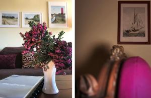 a vase filled with purple flowers sitting on a table at Ferienhaus Im Idyllischsten Winkel Rügens in Neuenkirchen +32 photos