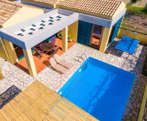 an overhead view of a house with a swimming pool at Barbati Beach - Villa Zante in Barbati