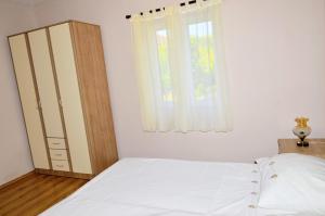 Postel nebo postele na pokoji v ubytování Wohnung In Vinišće Mit Privatem Parkplatz + 32 fotografií