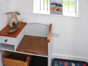 a room with a desk with a stuffed animal on it at Rhoshill in Llanfyrnach