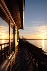 a porch of a house with a view of the water at Archipelago Hideaway - Oasis on the Sea in Värmdö