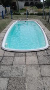 a swimming pool in the middle of a patio at hotel monte castello II in Villa Gesell