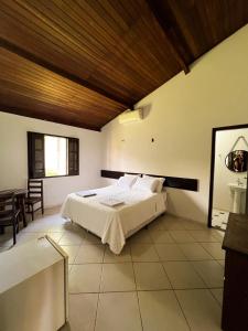 Ένα ή περισσότερα κρεβάτια σε δωμάτιο στο Pousada Manga Rosa