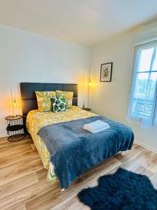 Postel nebo postele na pokoji v ubytování Le Petit S - Disneyland - Parking gratuit