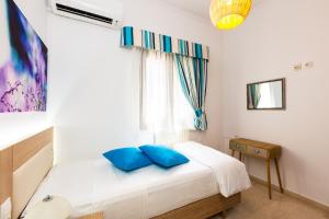 Ένα ή περισσότερα κρεβάτια σε δωμάτιο στο Kampos Villa Iii