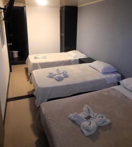 Postel nebo postele na pokoji v ubytování Hotel Capitalino Central