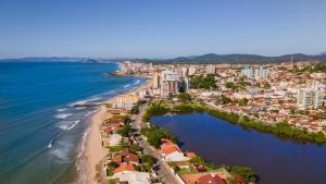 an aerial view of a city and the ocean at Refúgio Vibe do Mar in Barra Velha