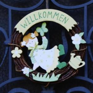 a wreath with a sheep and flowers on it at Vila Anton in Karlovy Vary