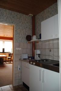 Kuchyň nebo kuchyňský kout v ubytování Wohnung In Goosefeld Mit Grill