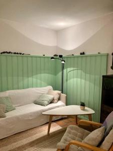 a living room with a couch and a table at Chesa Muntanaia in Pontresina