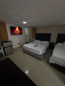 En eller flere senge i et værelse på Habitación corales cerca al mar