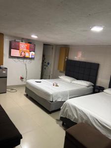 En eller flere senge i et værelse på Habitación corales cerca al mar