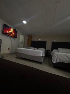 En eller flere senge i et værelse på Habitación corales cerca al mar + 2 billeder