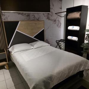 Giường trong phòng chung tại El Hostalito Metepec +110 ảnh