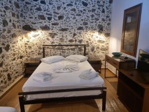 Ένα ή περισσότερα κρεβάτια σε δωμάτιο στο Elgina Apartments 1 Rethymno