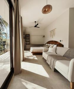 Ένα ή περισσότερα κρεβάτια σε δωμάτιο στο Casa Caona