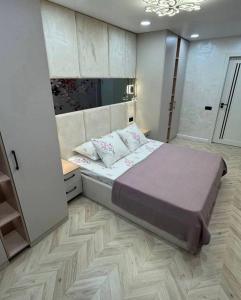 Ένα ή περισσότερα κρεβάτια σε δωμάτιο στο New hotel mirobod