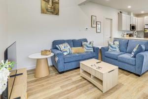 a living room with two blue couches and a table at Great for Travel Nurses 2BR East Dallas Townhome! in Dallas