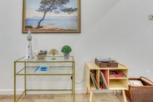 a room with a table and a painting on the wall at Great for Travel Nurses 2BR East Dallas Townhome! in Dallas